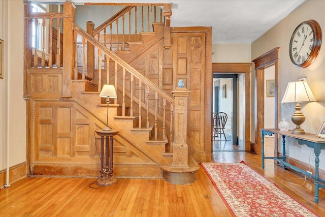 stairway with hardwood / wood-style flooring