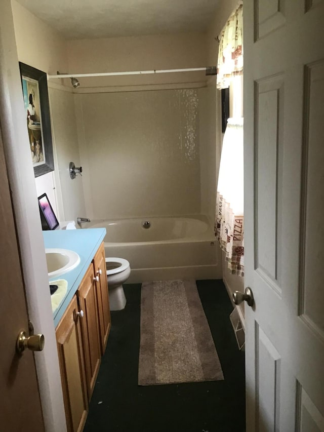 full bathroom featuring vanity, shower / tub combo, and toilet