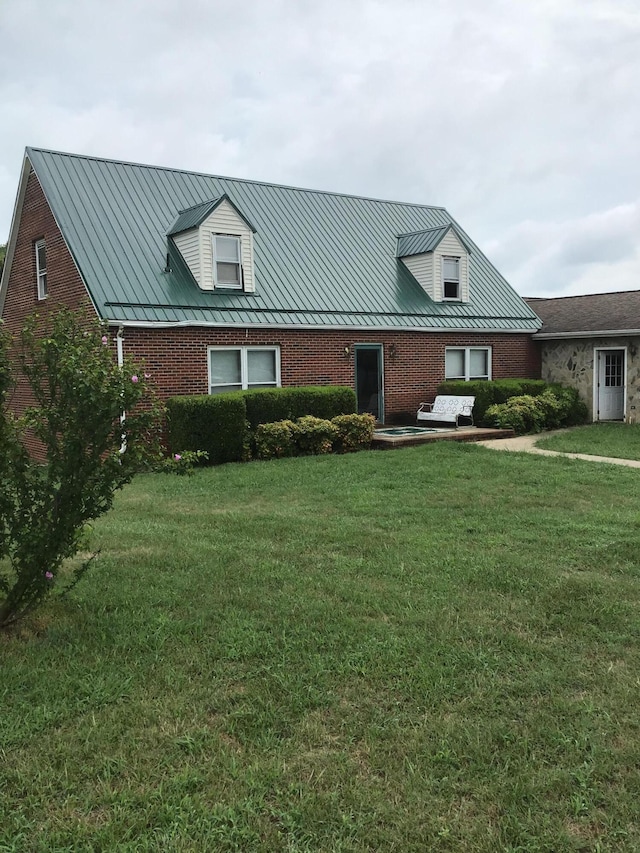 new england style home with a front lawn