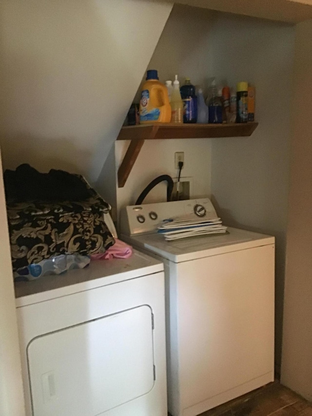 laundry area featuring independent washer and dryer and dark wood-type flooring