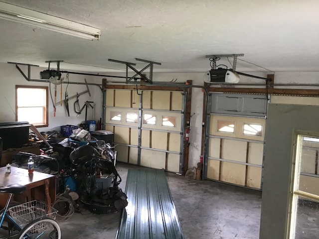 garage featuring a garage door opener