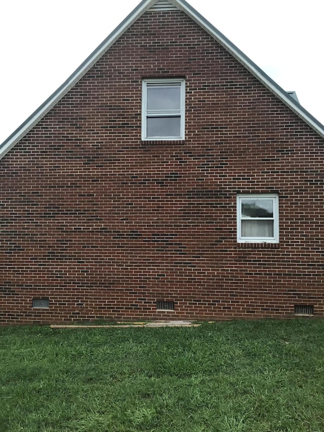 view of home's exterior featuring a yard