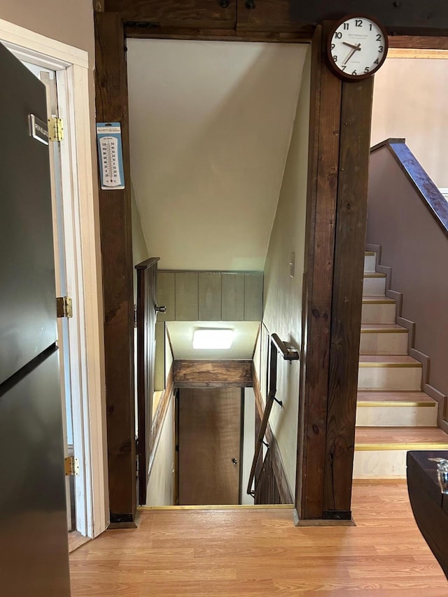 stairs with hardwood / wood-style flooring