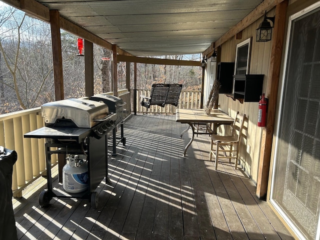 deck featuring a grill