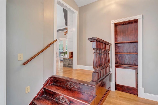 stairway featuring hardwood / wood-style floors