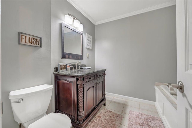 bathroom featuring tile patterned flooring, vanity, crown molding, and toilet