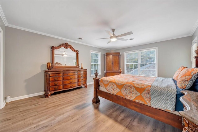 bedroom featuring ornamental molding, light wood-type flooring, and ceiling fan