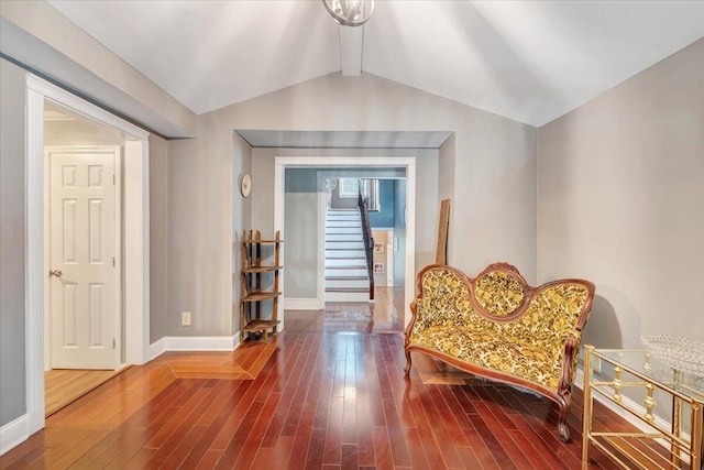 sitting room featuring hardwood / wood-style flooring and lofted ceiling with beams