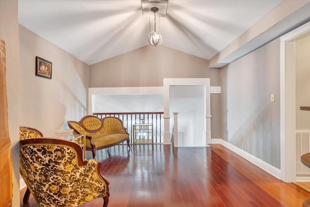 living area featuring hardwood / wood-style flooring and lofted ceiling