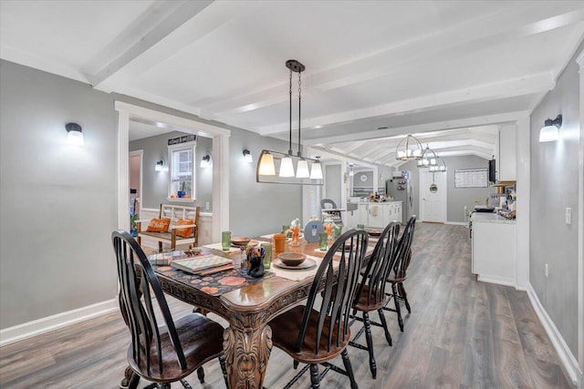 dining area with lofted ceiling with beams and hardwood / wood-style flooring