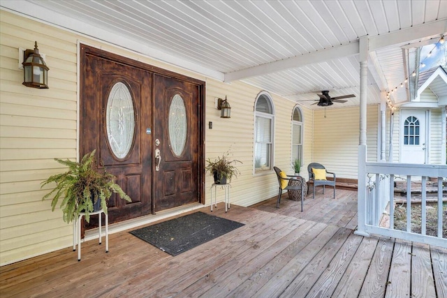 exterior space featuring ceiling fan and a porch