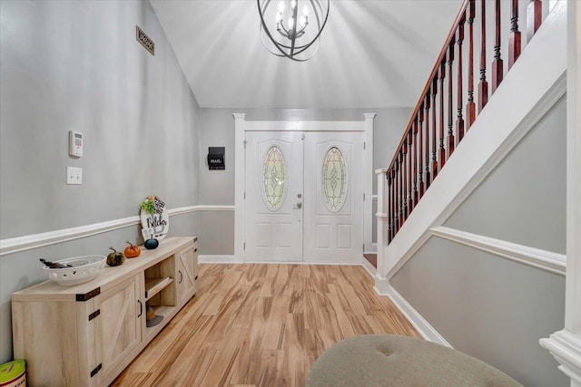 foyer featuring a notable chandelier and light hardwood / wood-style flooring