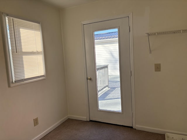 doorway with carpet flooring