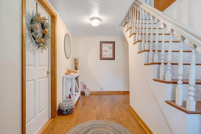 corridor featuring light hardwood / wood-style floors