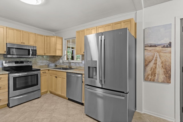 kitchen with appliances with stainless steel finishes, decorative backsplash, sink, and light brown cabinets