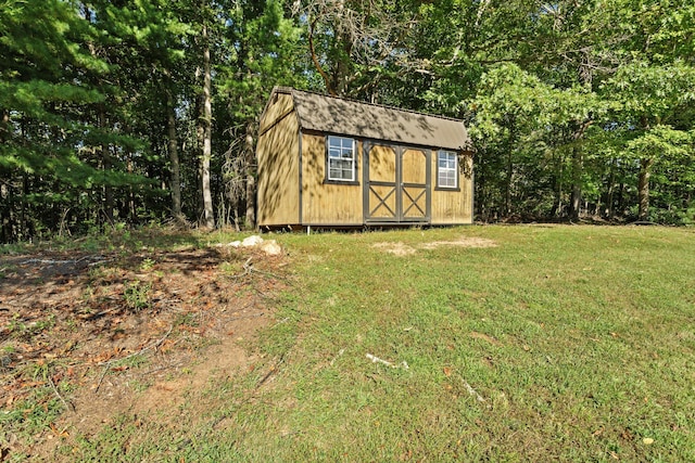 view of outdoor structure with a lawn