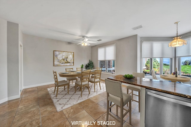 dining room featuring ceiling fan