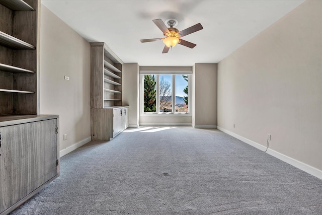 unfurnished living room with light carpet and ceiling fan