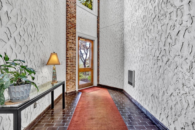 foyer entrance with a towering ceiling