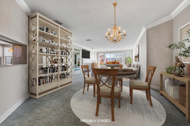 dining space with carpet flooring, a notable chandelier, and crown molding