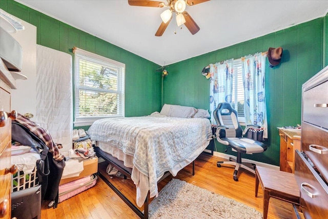 bedroom featuring light hardwood / wood-style floors and ceiling fan