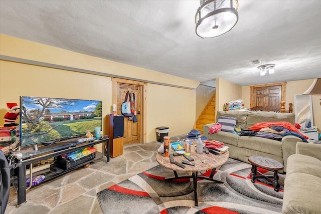 living room featuring a textured ceiling