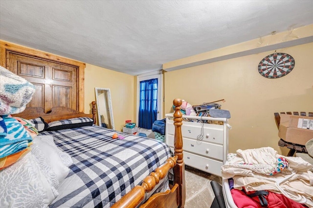 bedroom featuring a textured ceiling