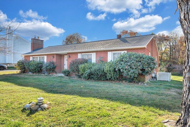 ranch-style house with a front lawn