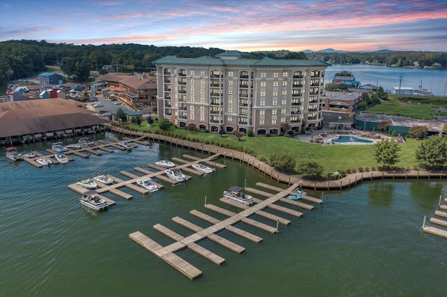 aerial view at dusk with a water view