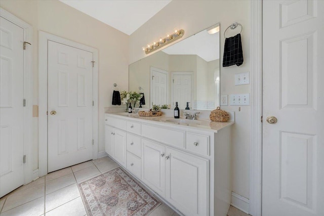 bathroom with tile patterned flooring and vanity