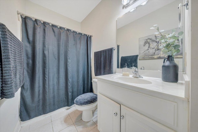 bathroom with a shower with curtain, tile patterned floors, vanity, and toilet