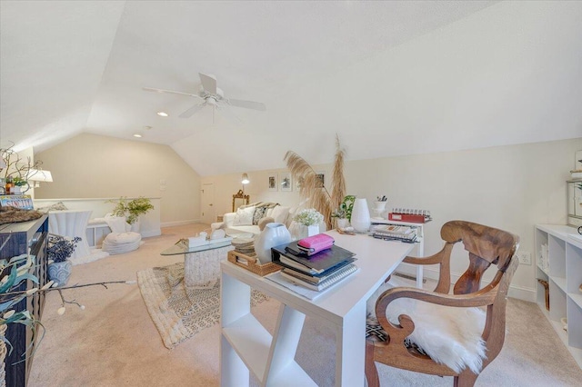 home office featuring ceiling fan, light colored carpet, and vaulted ceiling