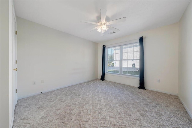 empty room with light carpet and ceiling fan