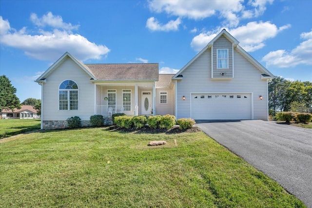 view of front facade featuring a front yard, a garage, and a porch