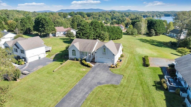 birds eye view of property with a mountain view