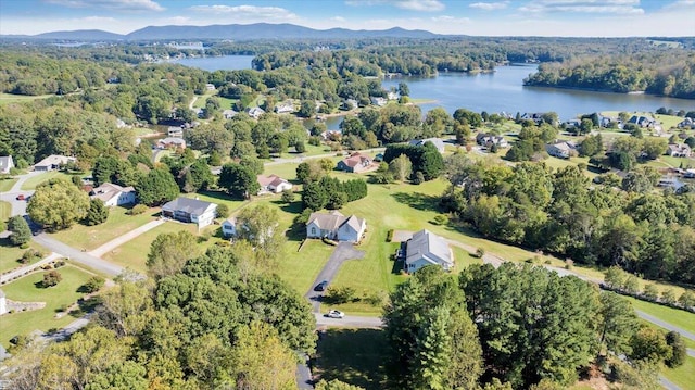 birds eye view of property featuring a water and mountain view