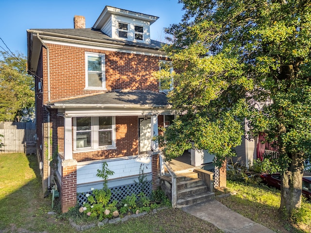 view of front of home with a front lawn