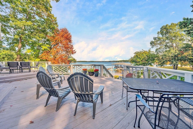 wooden deck with a water view