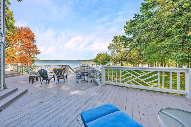 deck featuring a water view