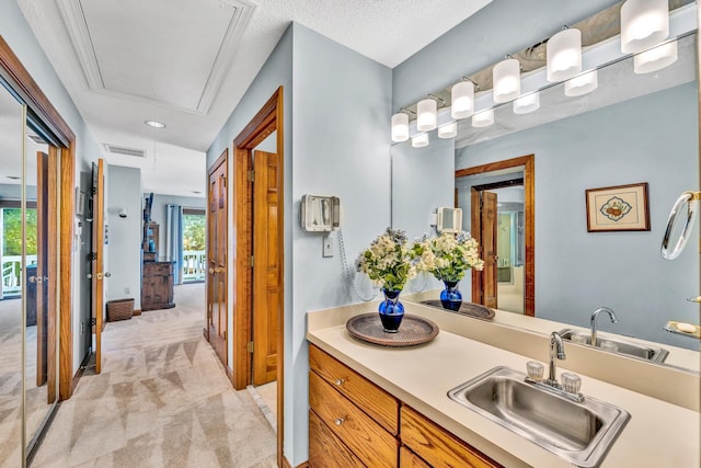 bathroom with vanity and a textured ceiling