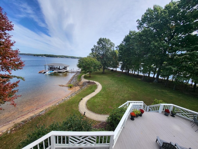 exterior space with central air condition unit, a yard, and a water view