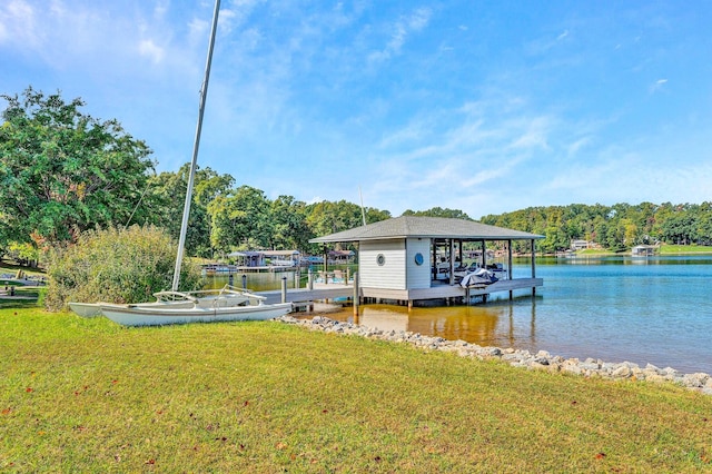 view of dock featuring a lawn and a water view