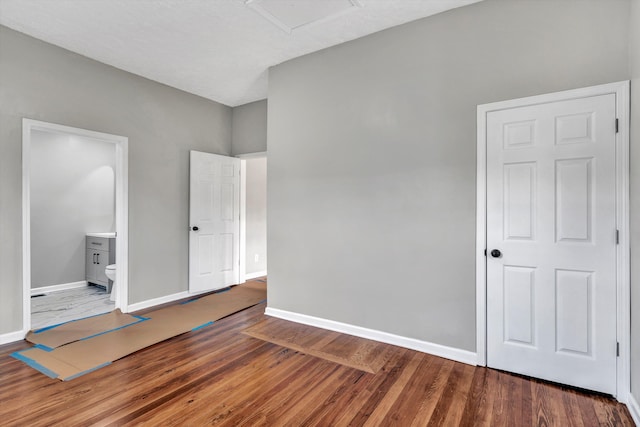 unfurnished bedroom with hardwood / wood-style flooring