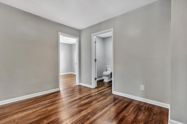 spare room featuring dark hardwood / wood-style floors