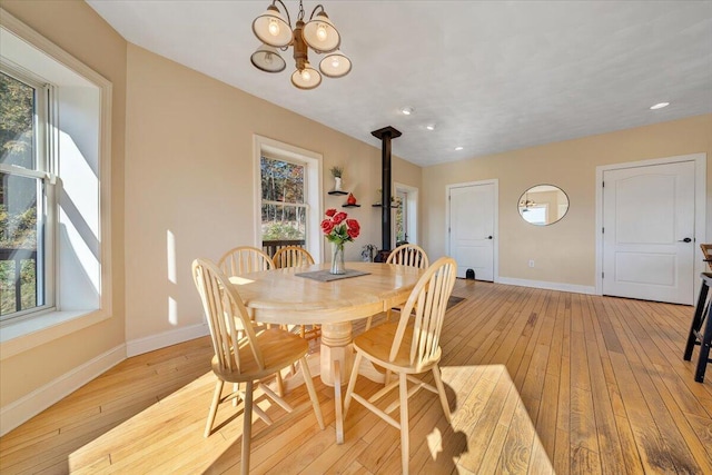 dining space featuring a healthy amount of sunlight and light hardwood / wood-style flooring