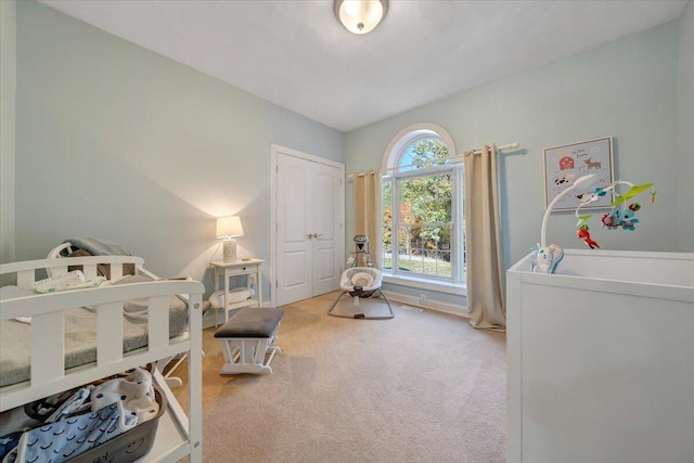 carpeted bedroom with a closet