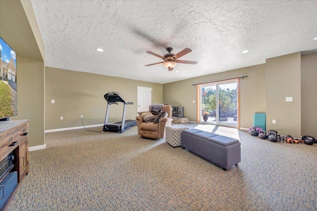 bedroom with ceiling fan, carpet flooring, a textured ceiling, and access to outside