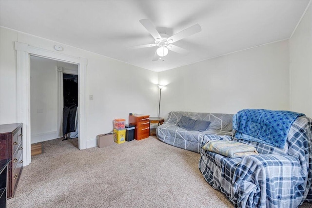 carpeted living room with ceiling fan