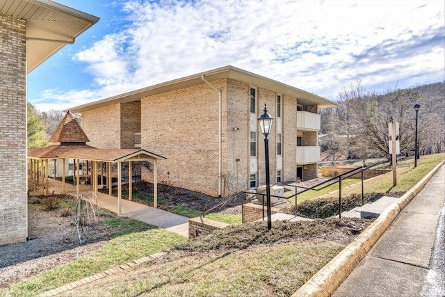 5260 Crossbow Cir Unit 3D, Roanoke, VA 24018 - view of property exterior featuring brick siding and fence