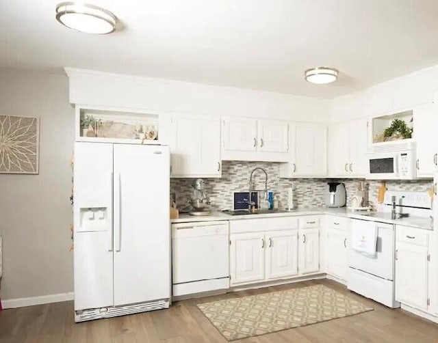 5260 Crossbow Cir Unit 3D, Roanoke, VA 24018 - kitchen with white appliances, a sink, light countertops, backsplash, and white cabinets